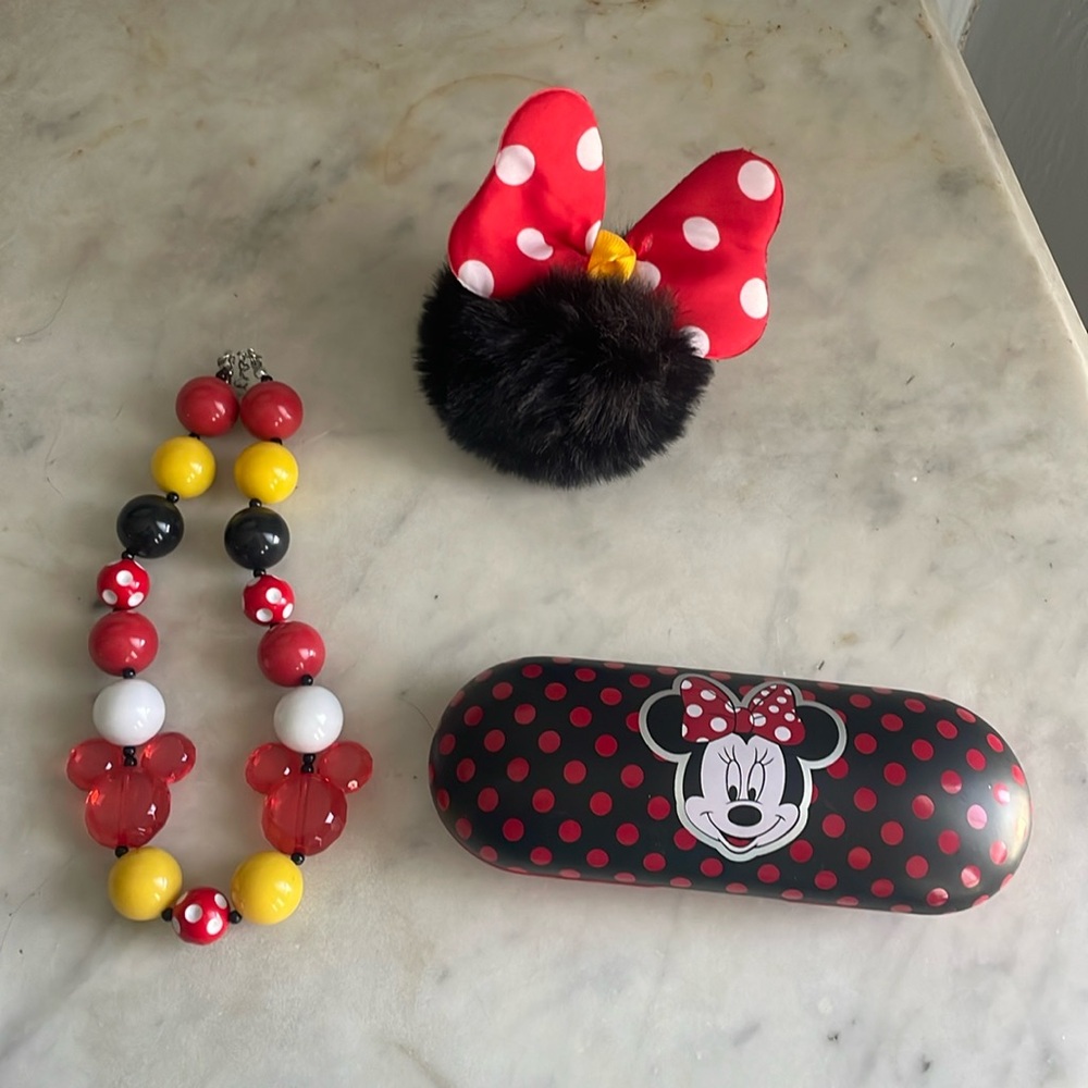 Minnie Mouse bundle of items. Necklace, glasses case, and backpack dangle.